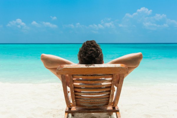 Man-Relaxing-on-Beach.jpg