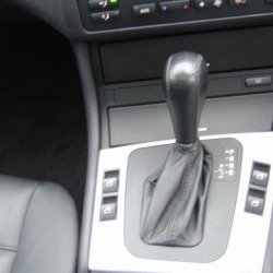 automatic   steptronic   tiptronic with traction control button in  background