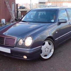 My 1998 E240 Designo AMG in Varicolour II.  Black Leather, purple grey wood.