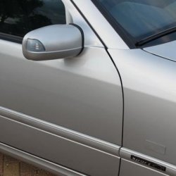 W210 E-Class blinking indicator door mirrors with body-coloured aluminium plates covering the existing repeater holes

DTM Sport Edition side badges