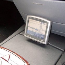 TomTom 4 - in use and neat. The TomTom1 has to be folded back slightly when you need to access and insert a CD/DVD but that a matter of push release.