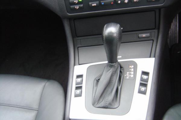 automatic   steptronic   tiptronic with traction control button in  background