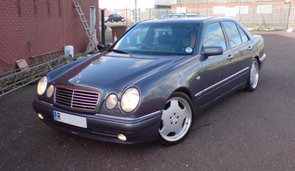 My 1998 E240 Designo AMG in Varicolour II.  Black Leather, purple grey wood.