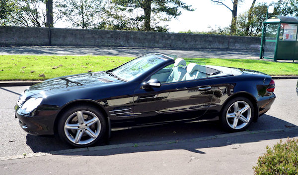 Shiny side view, nothing better than a gleaming metalic black.