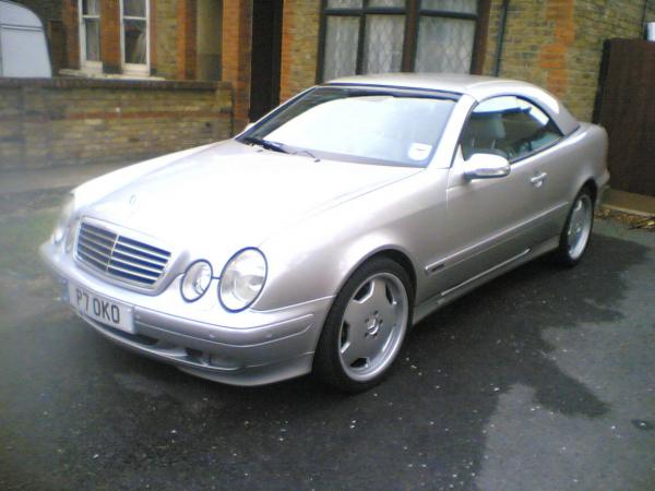 The 1st day home. Bone stock CLK 430 with custom hard top. She was bought in spring '04.