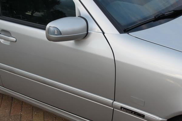 W210 E-Class blinking indicator door mirrors with body-coloured aluminium plates covering the existing repeater holes

DTM Sport Edition side badges